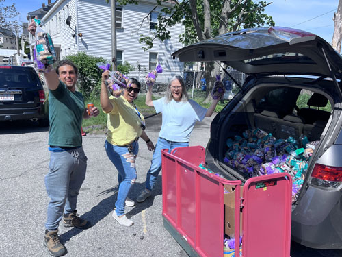neighbors in need staff unloading car of donations